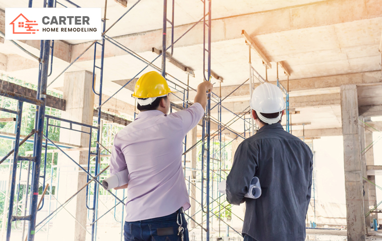 Engineers at a construction site discussing building permit approval.